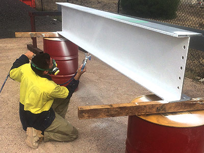 Fire spraying structural steel